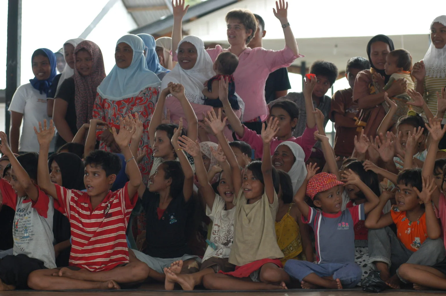Dr. Sara Beneit in a community health workshop with children