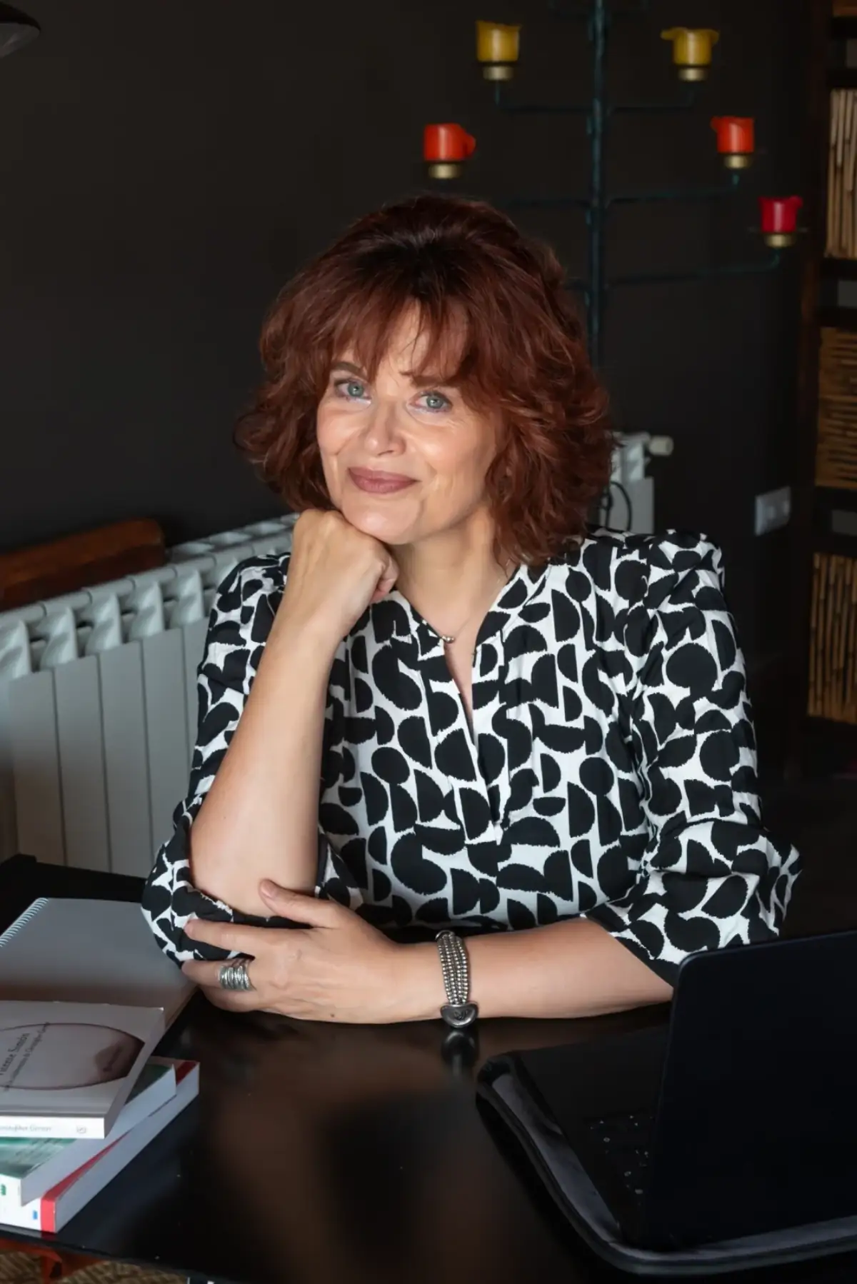 Dr. Sara Beneit at her desk in her private psychotherapy office